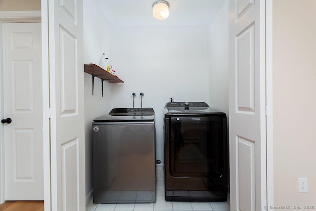 washroom with washing machine and clothes dryer