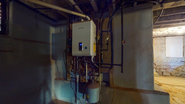 utility room featuring tankless water heater