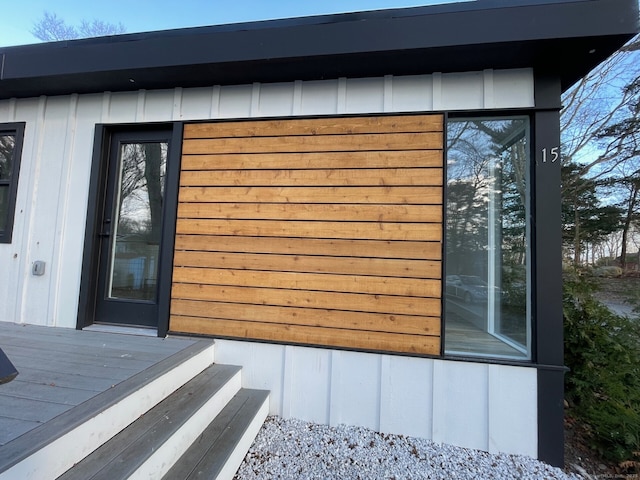 view of side of property featuring a wooden deck