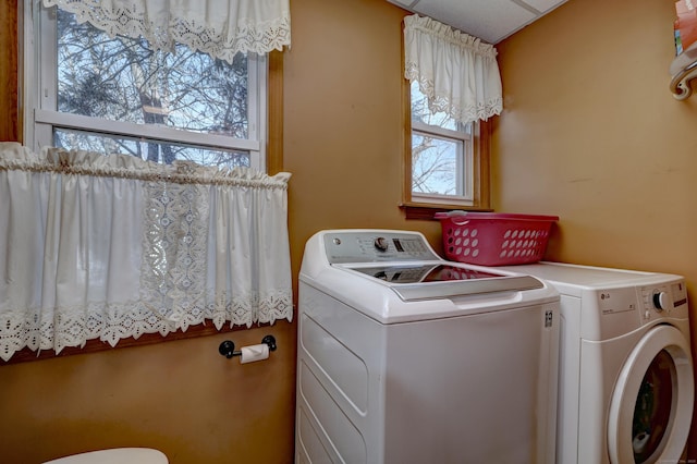 washroom with washing machine and dryer