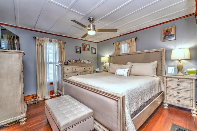 bedroom featuring crown molding, ceiling fan, and dark wood-type flooring