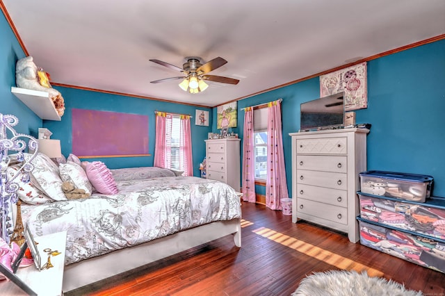 bedroom with hardwood / wood-style flooring, ceiling fan, and crown molding