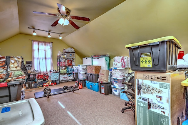 interior space with ceiling fan and vaulted ceiling