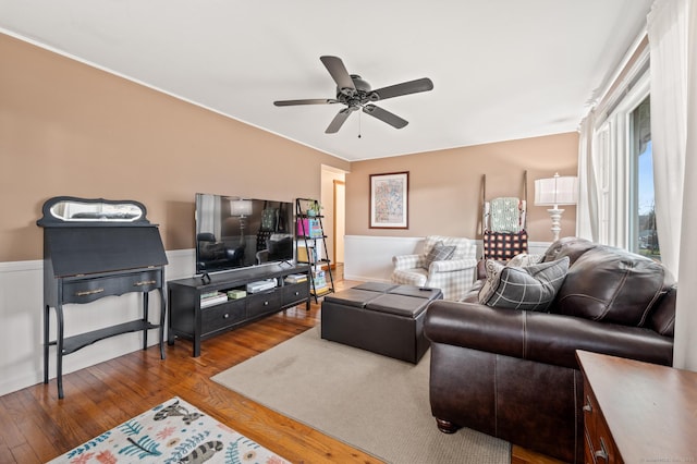 living room with hardwood / wood-style flooring and ceiling fan