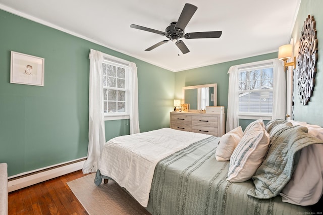 bedroom with ceiling fan, crown molding, a baseboard radiator, and dark hardwood / wood-style floors