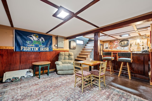 interior space featuring wooden walls and bar