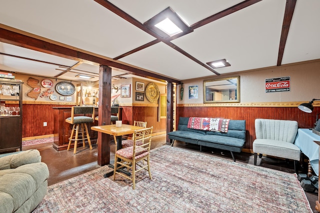 living room featuring indoor bar and wooden walls