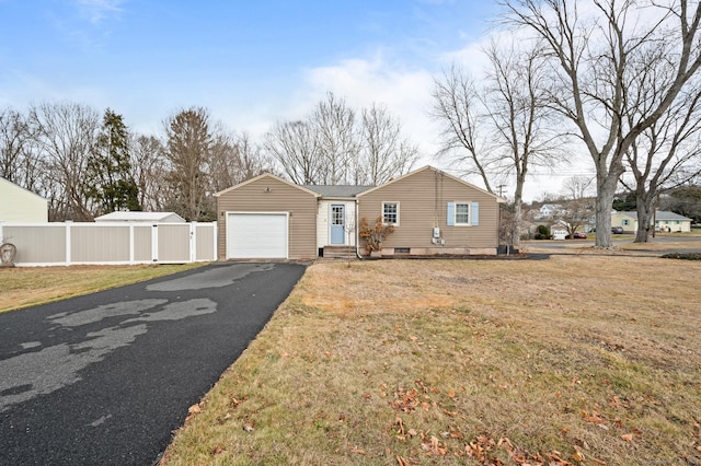 ranch-style home featuring a front lawn and a garage