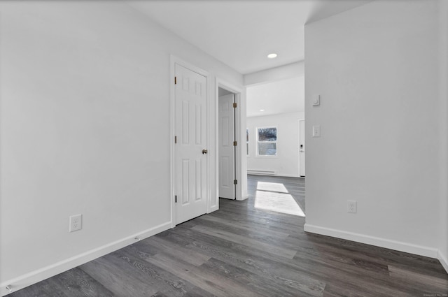 corridor with dark wood-type flooring