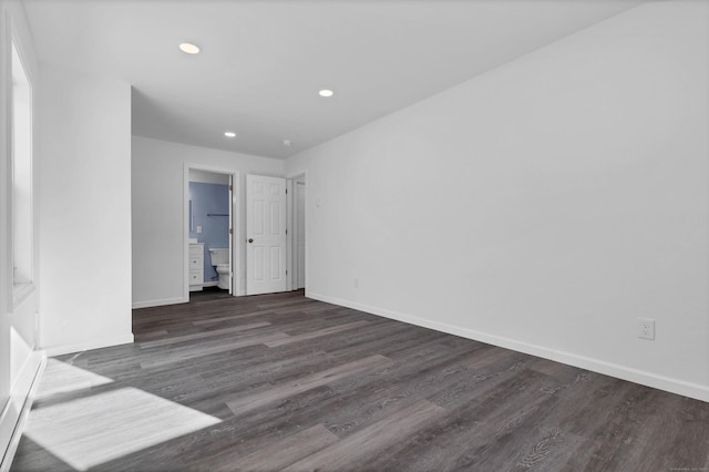 spare room with dark hardwood / wood-style flooring