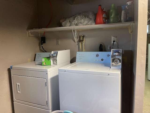 washroom with washing machine and clothes dryer