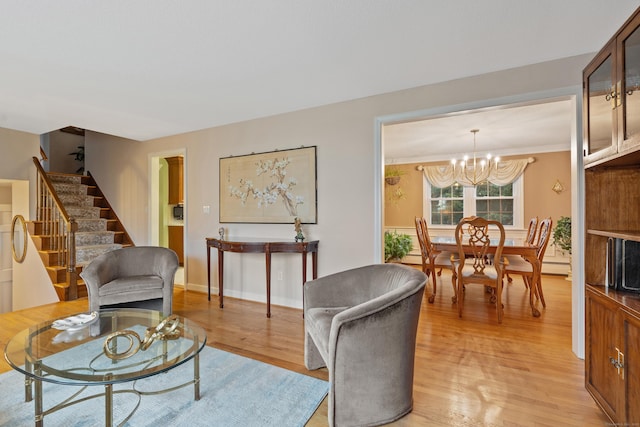 living room featuring light wood-type flooring and a notable chandelier