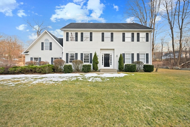 colonial inspired home with a front yard