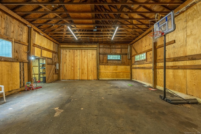 garage featuring wooden walls