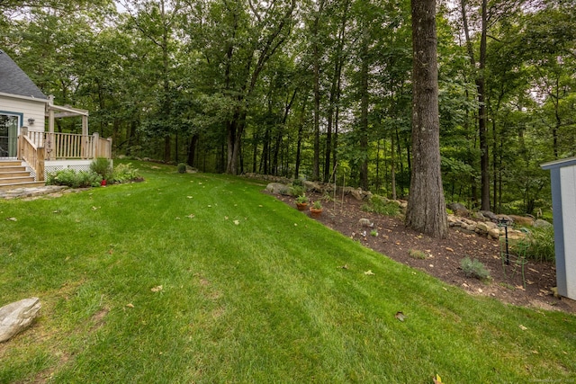 view of yard with a deck