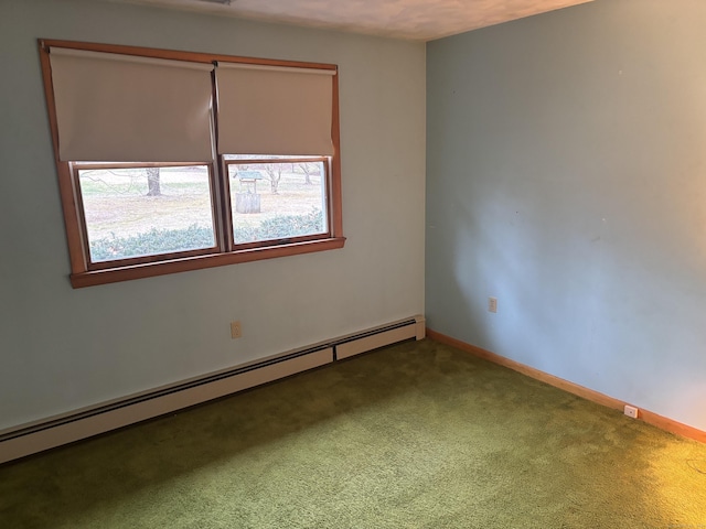 carpeted empty room featuring a baseboard radiator