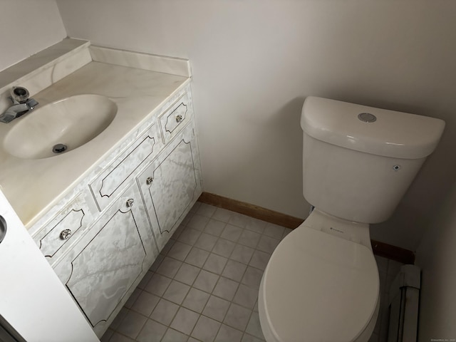 bathroom featuring tile patterned floors, vanity, and toilet