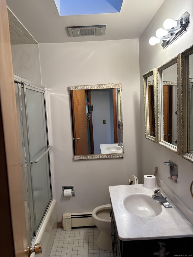 full bathroom with vanity, tile patterned floors, combined bath / shower with glass door, a skylight, and a baseboard radiator