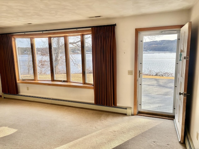 145 Massapeag Side Rd, Montville, CT 06382 - unfurnished room with baseboard heating, carpet flooring, and a water view