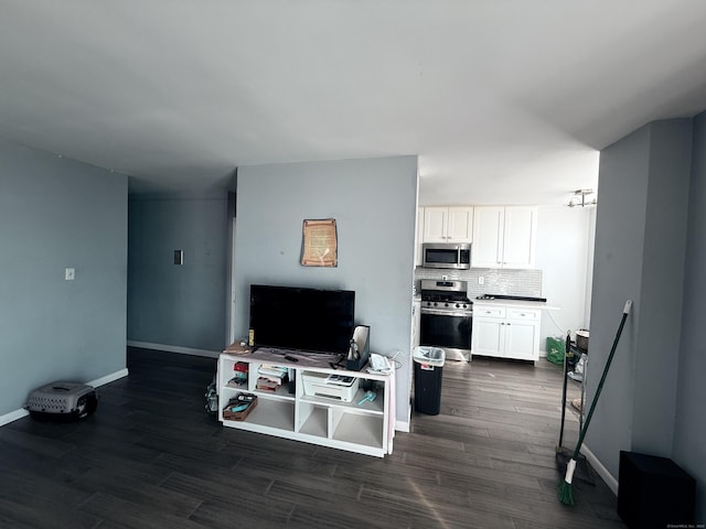 living room with dark hardwood / wood-style flooring