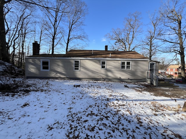 view of snow covered house