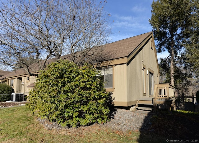 view of side of property with central AC