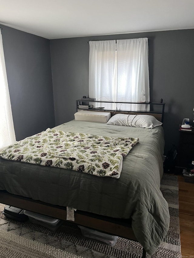 bedroom featuring wood-type flooring