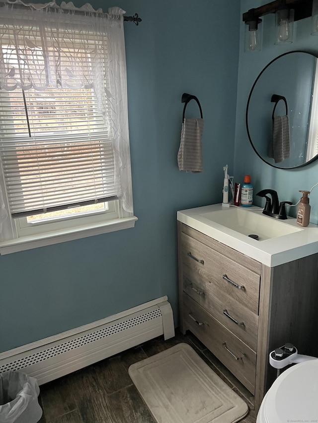 bathroom with vanity and a baseboard radiator