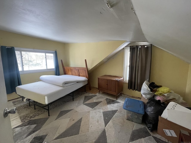 bedroom featuring lofted ceiling