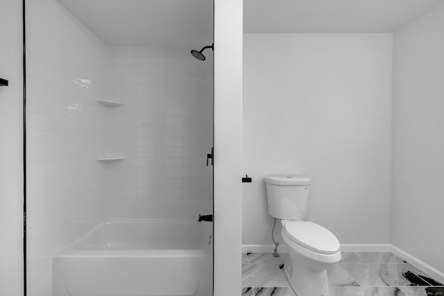 bathroom with shower / bathing tub combination and toilet