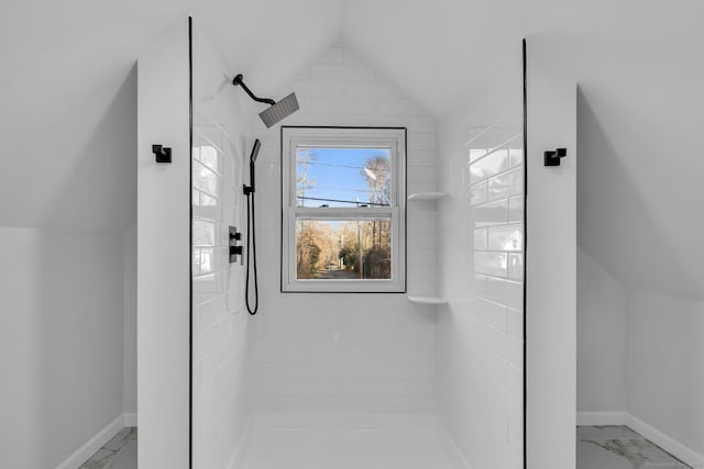 interior details featuring tiled shower