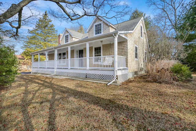 view of front of home with a front lawn and covered porch