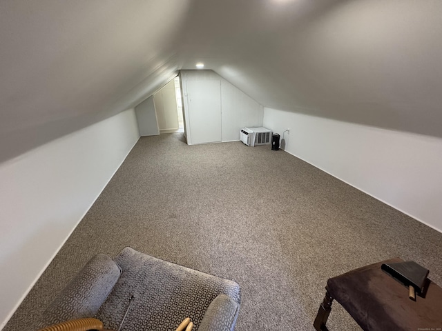 bonus room with lofted ceiling and carpet floors