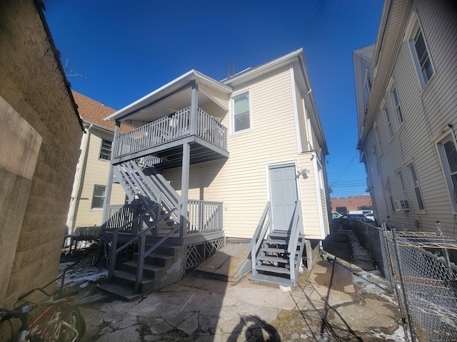 rear view of house with a balcony