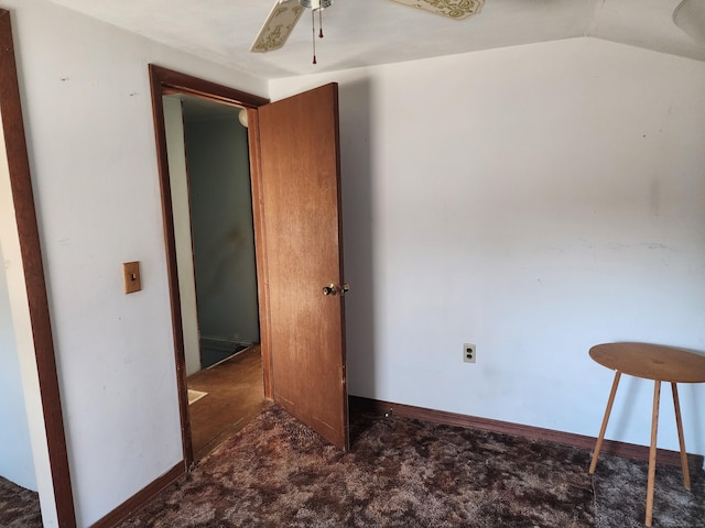 spare room featuring lofted ceiling and ceiling fan