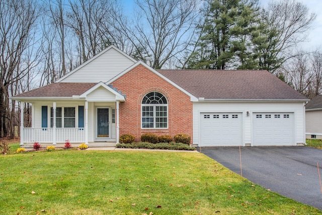 view of front of house with a front lawn, a porch, and a garage