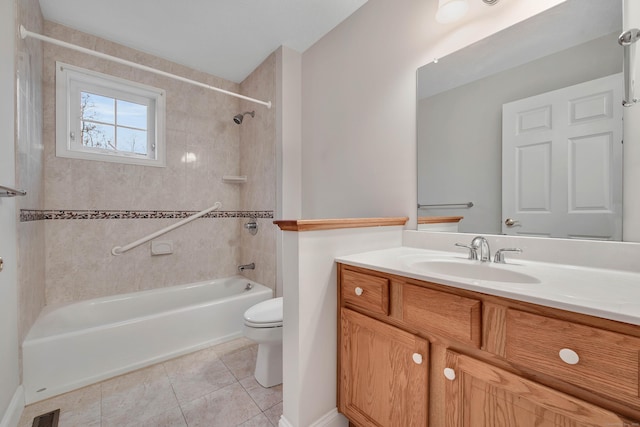 full bathroom featuring toilet, tiled shower / bath combo, vanity, and tile patterned floors