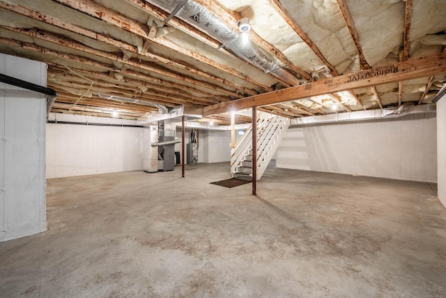 basement featuring heating unit and gas water heater