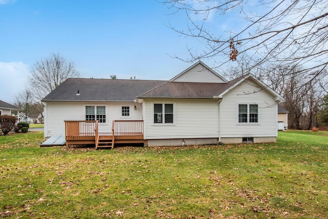 back of house featuring a deck and a lawn