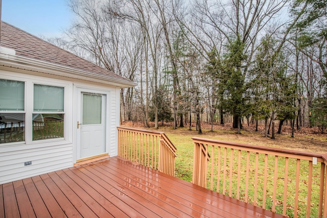 wooden terrace with a yard