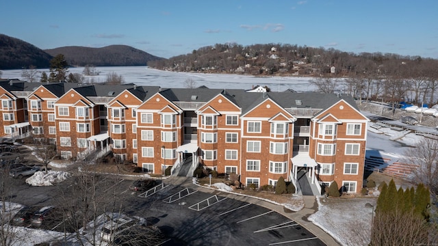 snow covered property with a mountain view