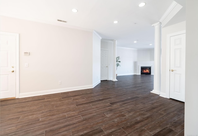 unfurnished living room featuring ornamental molding, dark hardwood / wood-style flooring, and decorative columns