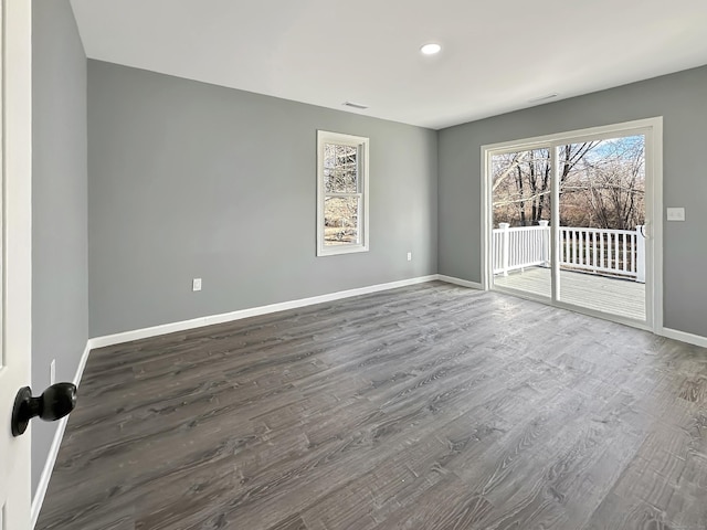 empty room featuring dark hardwood / wood-style flooring