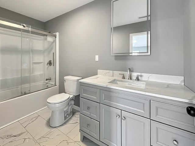 full bathroom with vanity, shower / bath combination with glass door, and toilet