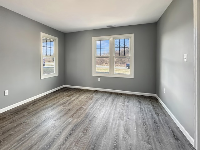 empty room with hardwood / wood-style flooring