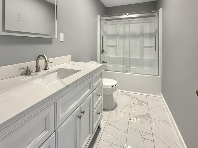 full bathroom featuring vanity, bath / shower combo with glass door, and toilet