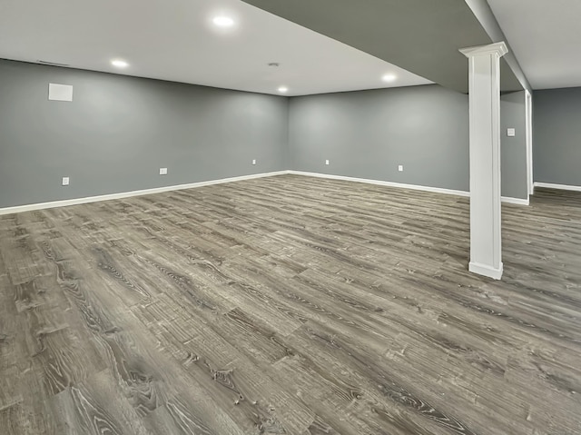 basement featuring hardwood / wood-style floors