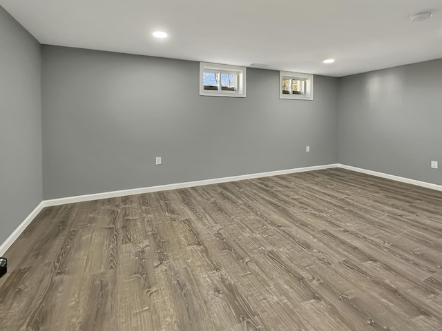 basement with hardwood / wood-style floors