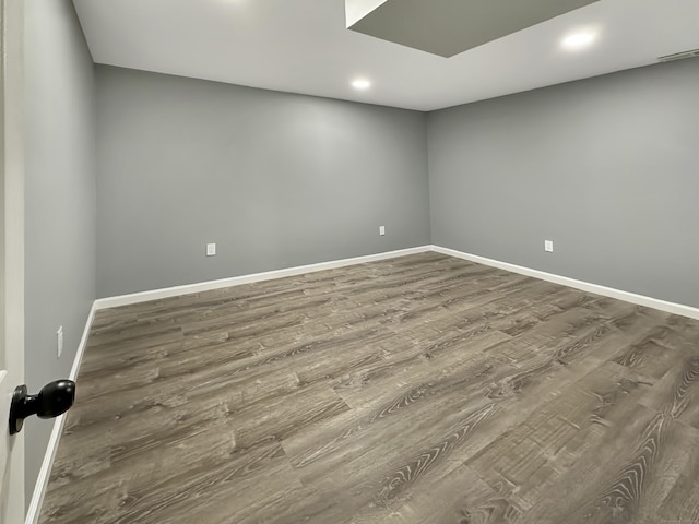 unfurnished room featuring hardwood / wood-style flooring