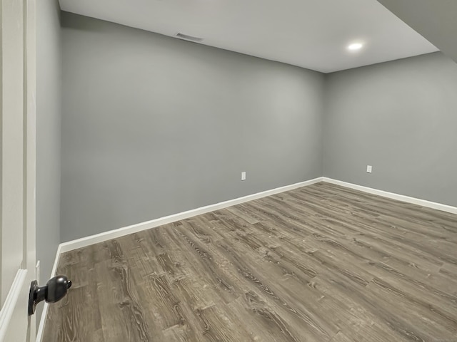 empty room featuring hardwood / wood-style flooring